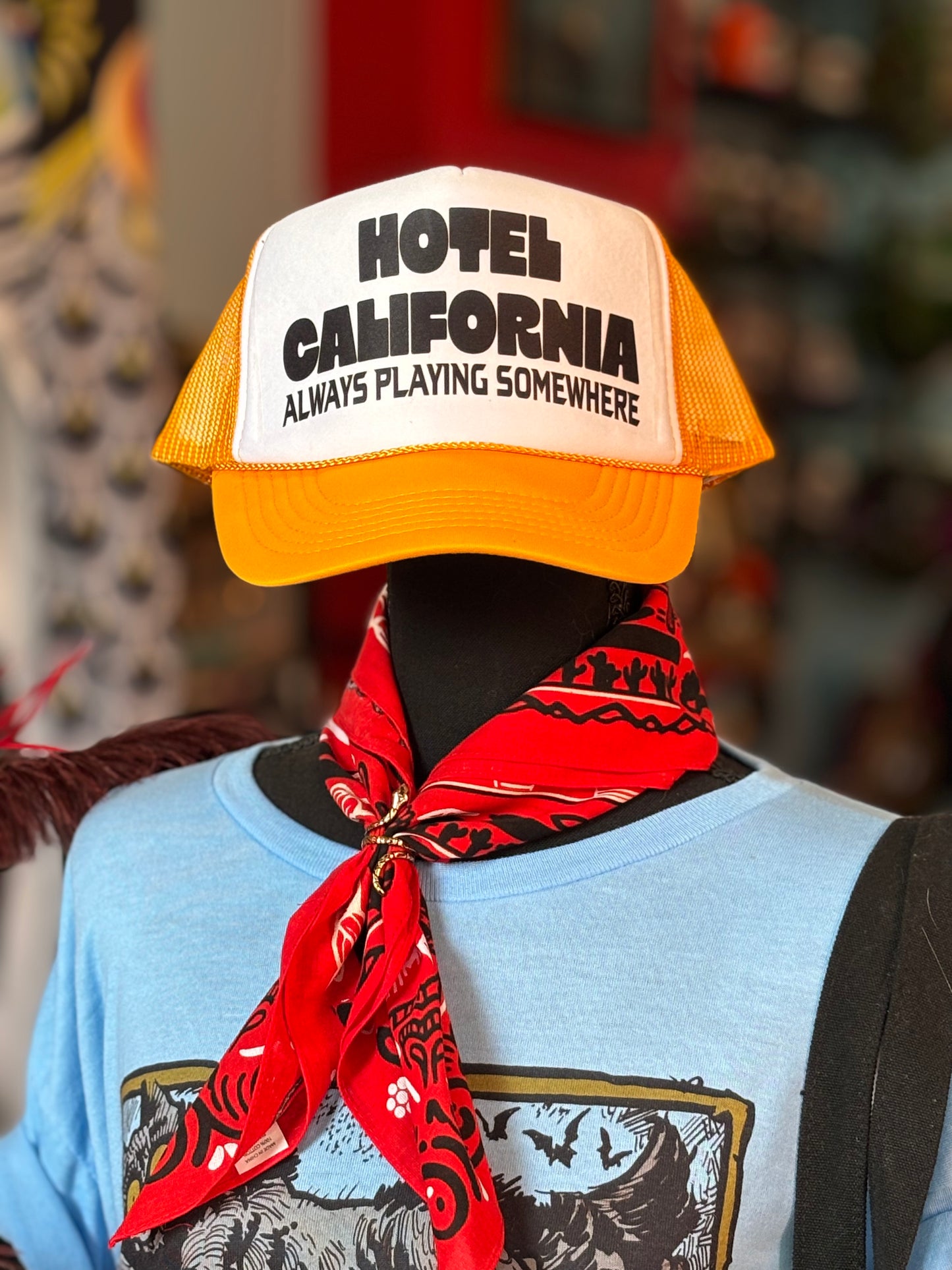 HOTEL CALIFORNIA ALWAYS PLAYING SOMEWHERE Trucker Hat