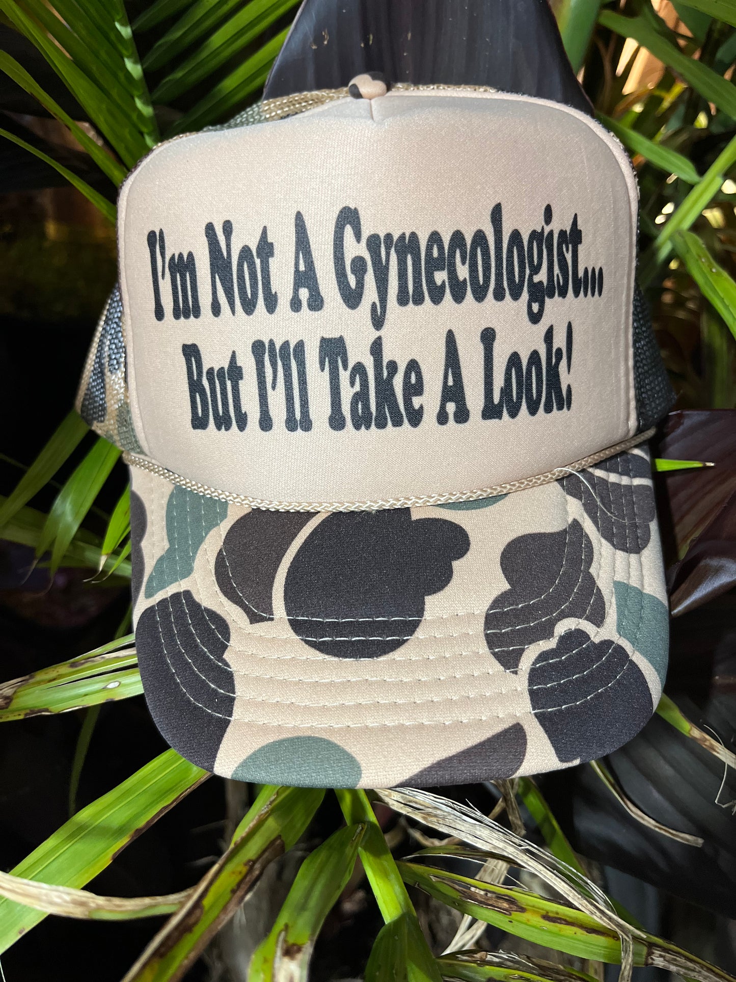 I'M NOT A GYNECOLOGIST BUT I'LL TAKE A LOOK Trucker Hat